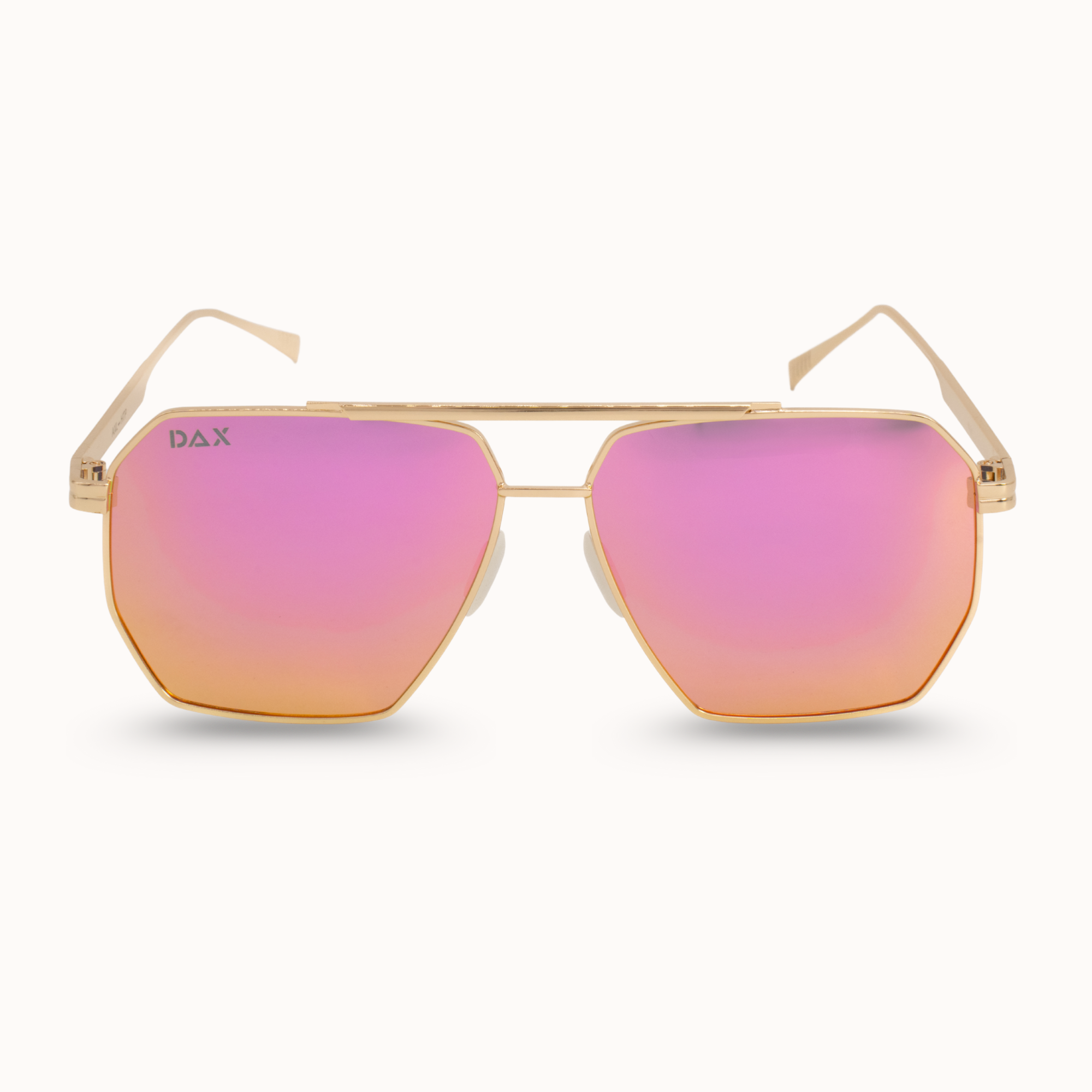 Sunglasses with pink lenses and gold frame on a white background