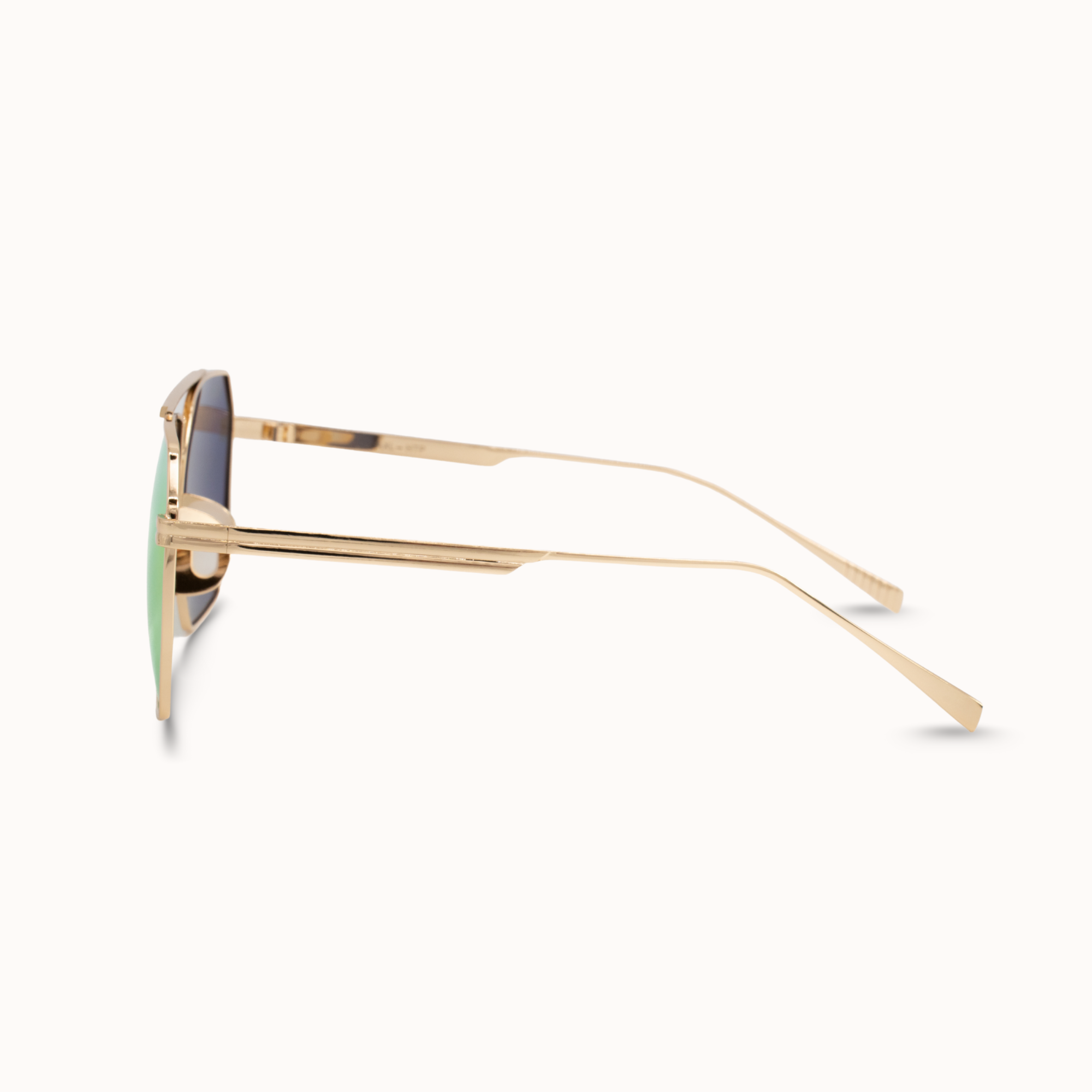 Gold-framed sunglasses on a white background