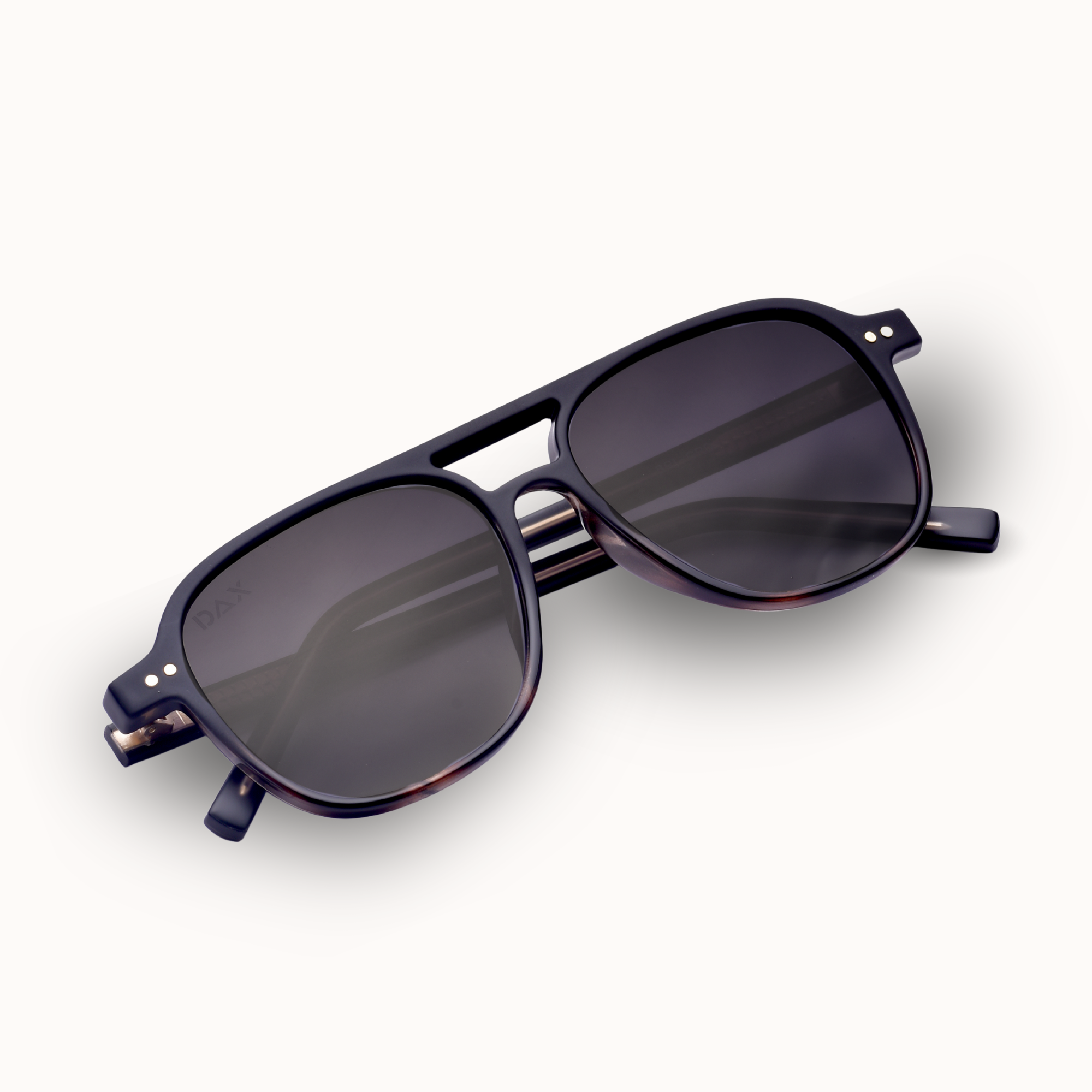 Black sunglasses with dark lenses on a white background
