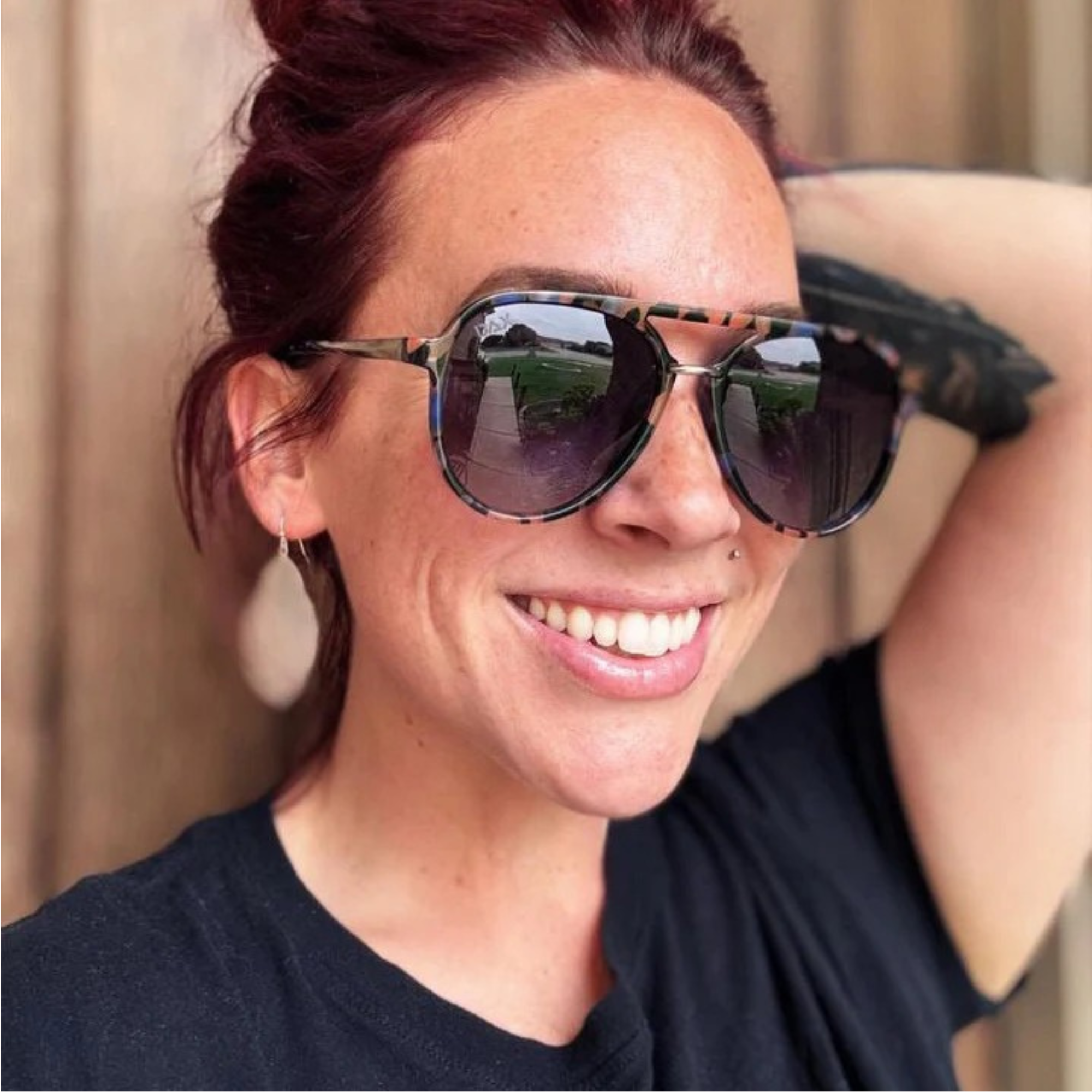 Woman wearing sunglasses with a blurred background