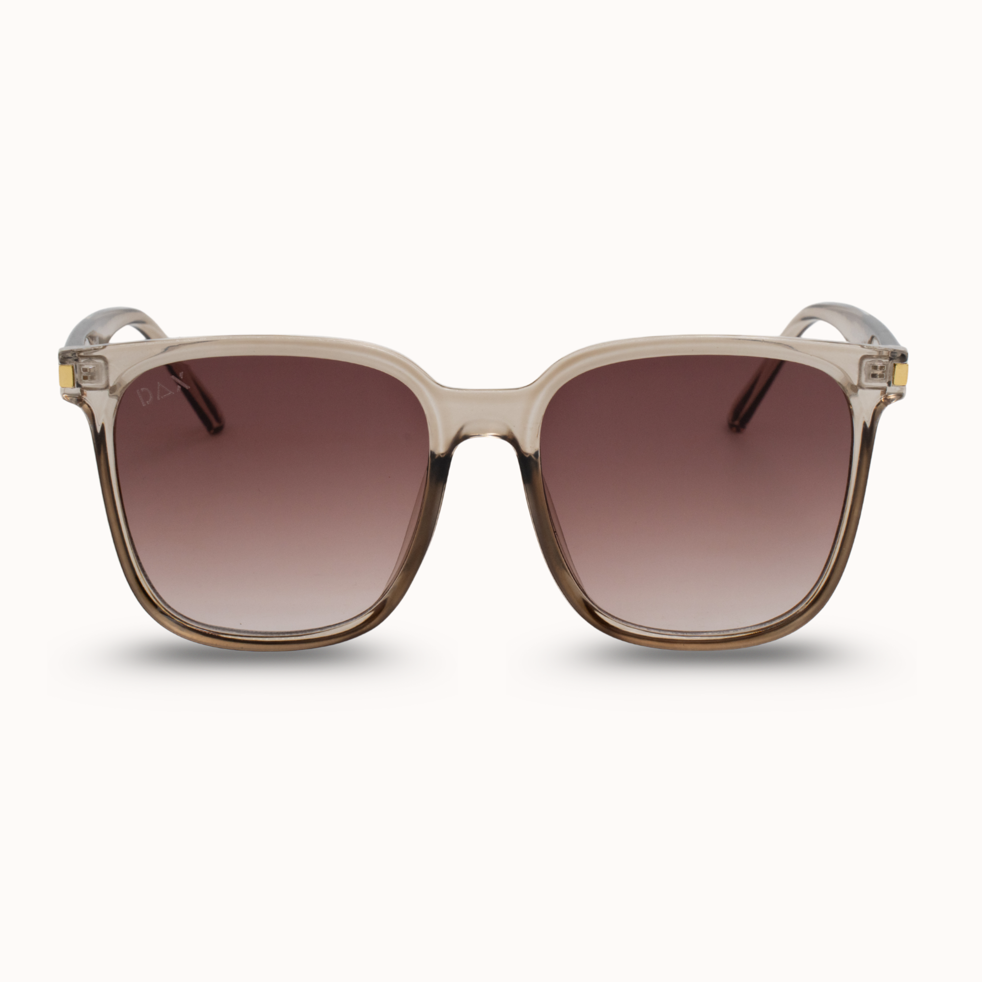 Sunglasses with a beige frame and brown gradient lenses on a white background