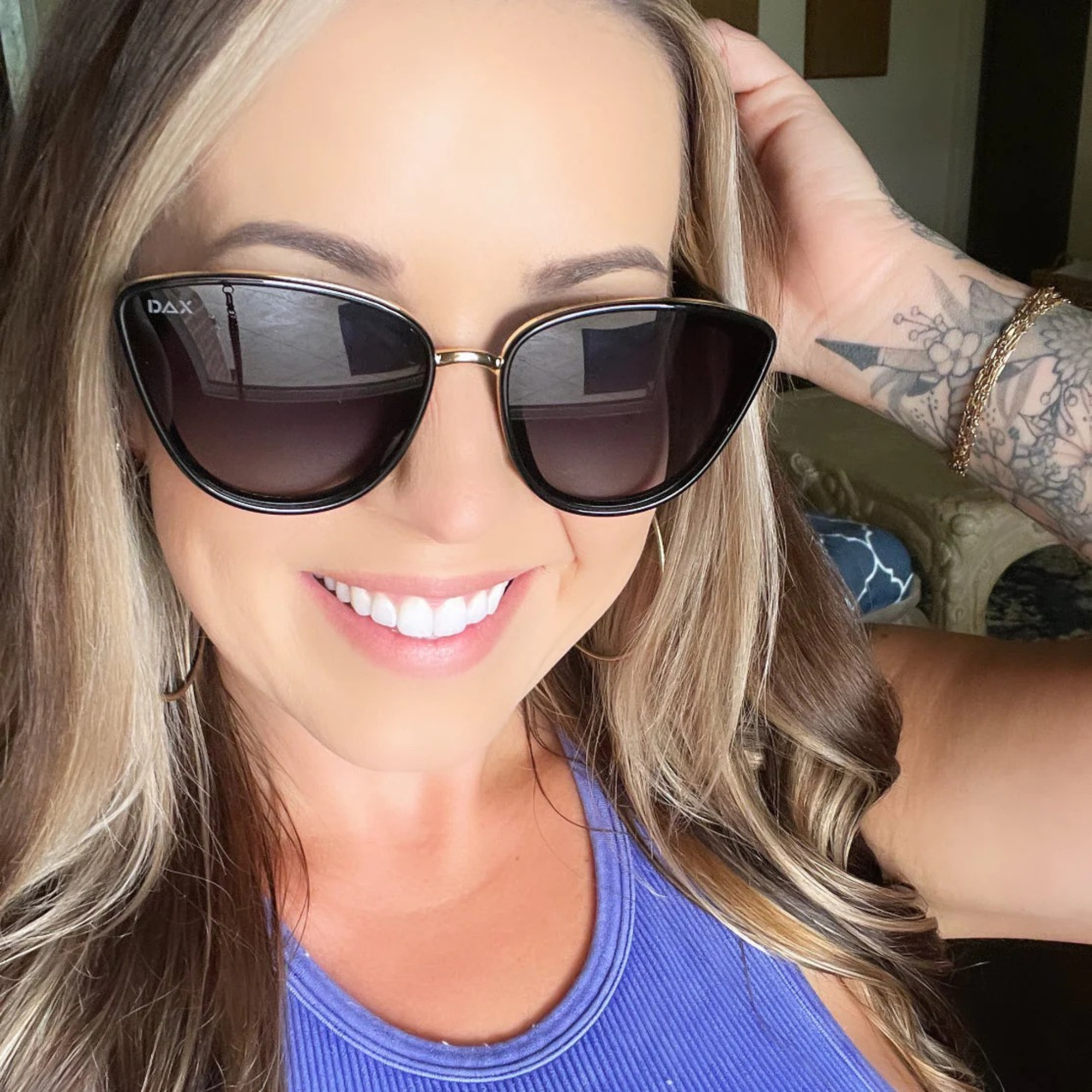 Woman wearing sunglasses with a blurred background