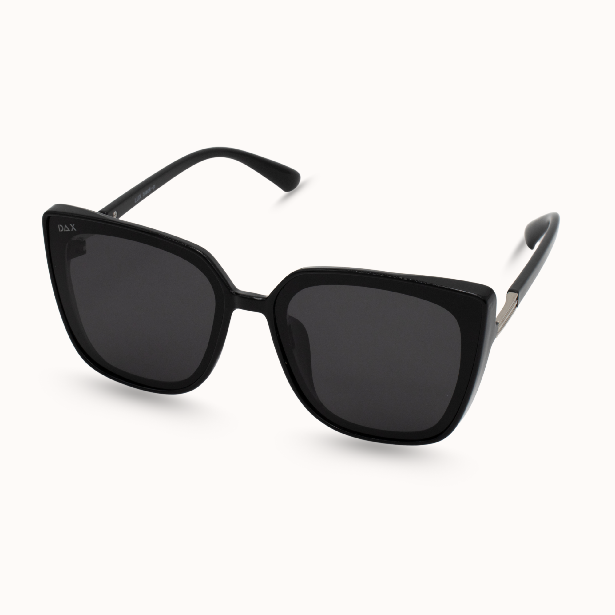 Black sunglasses with dark lenses on a white background