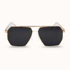 Gold-framed sunglasses with black lenses on a white background