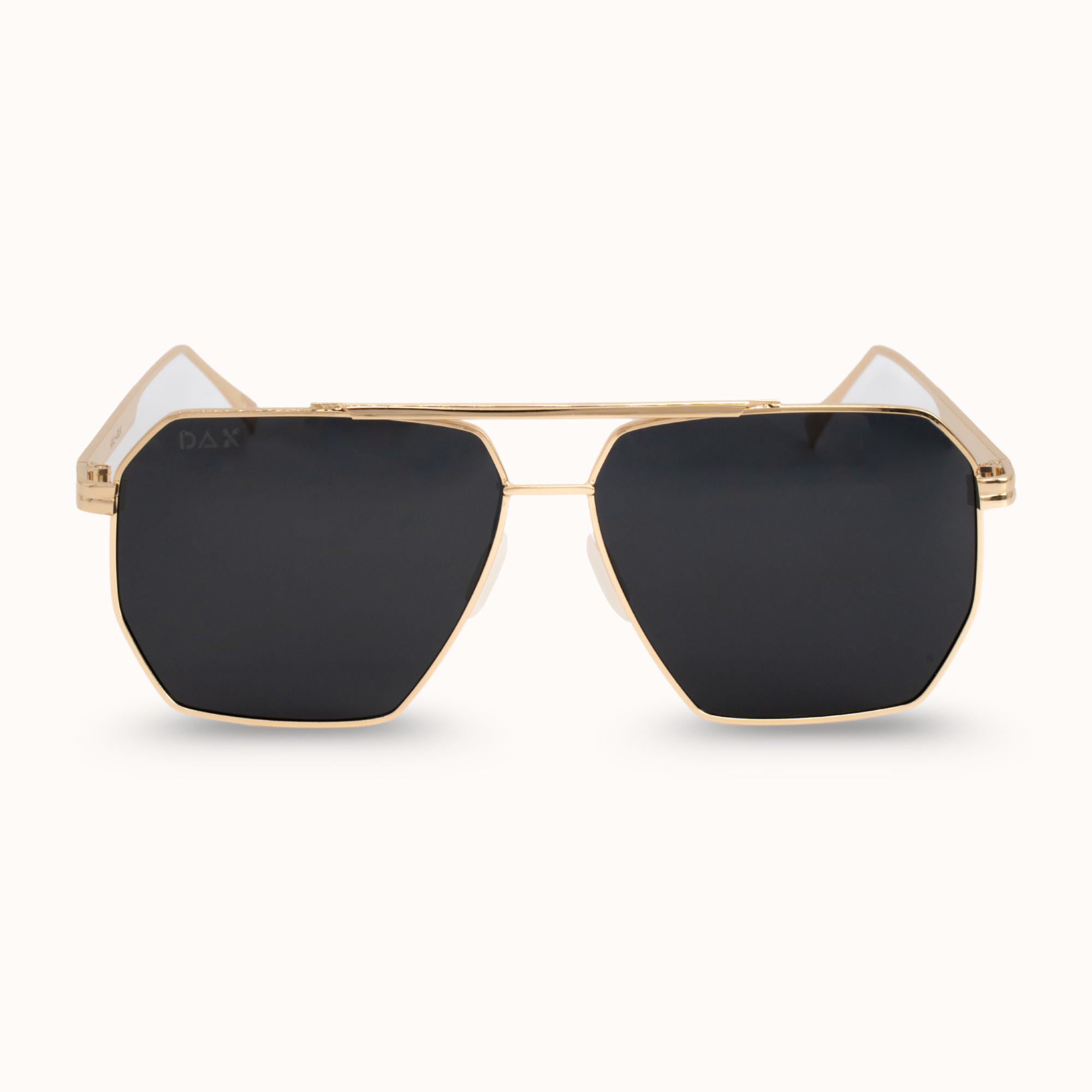 Gold-framed sunglasses with black lenses on a white background