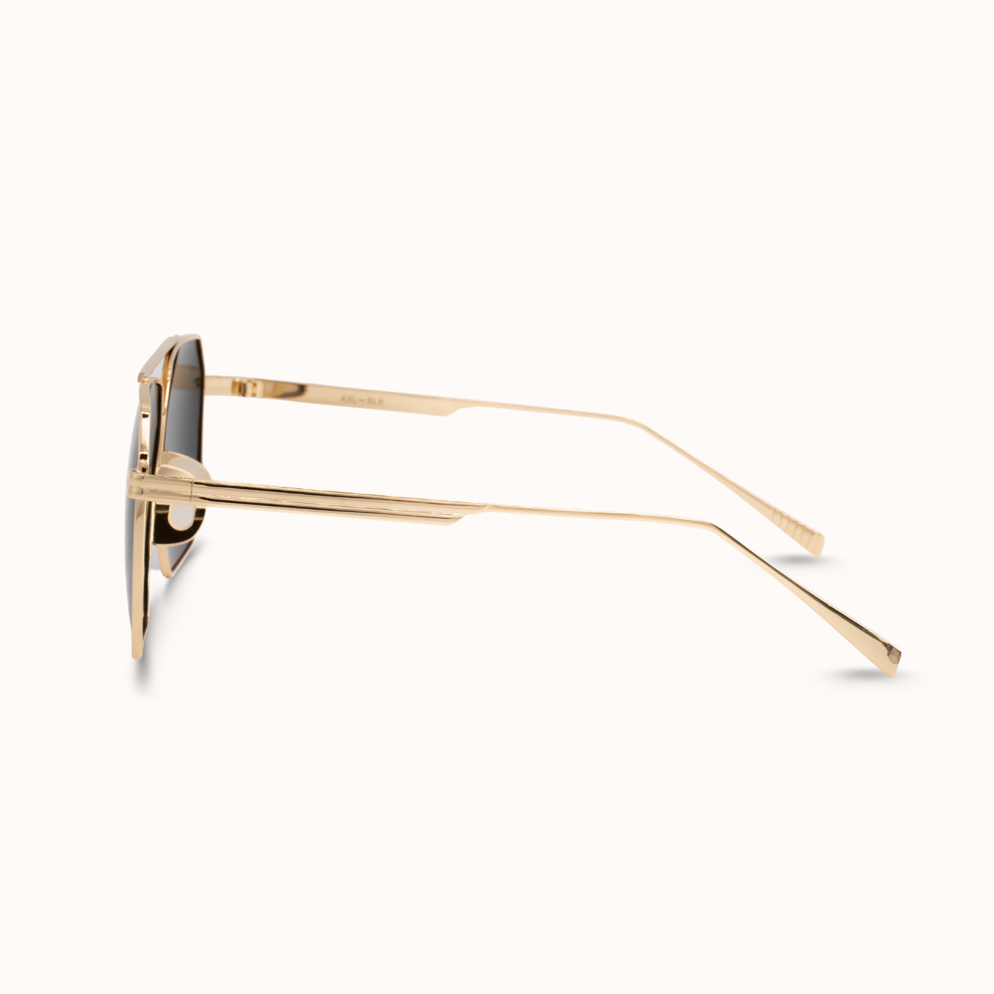 Gold-framed sunglasses on a white background