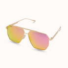 Gold-framed sunglasses with pink-tinted lenses on a white background
