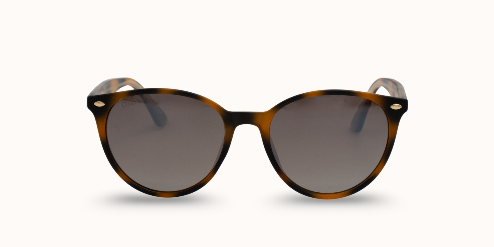 Sunglasses with tortoiseshell frame and dark lenses on a white background