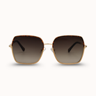 Sunglasses with gold frame and dark lenses on a white background