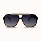 Sunglasses with a black and gold frame on a white background