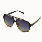 Sunglasses with black and gold frame on a white background