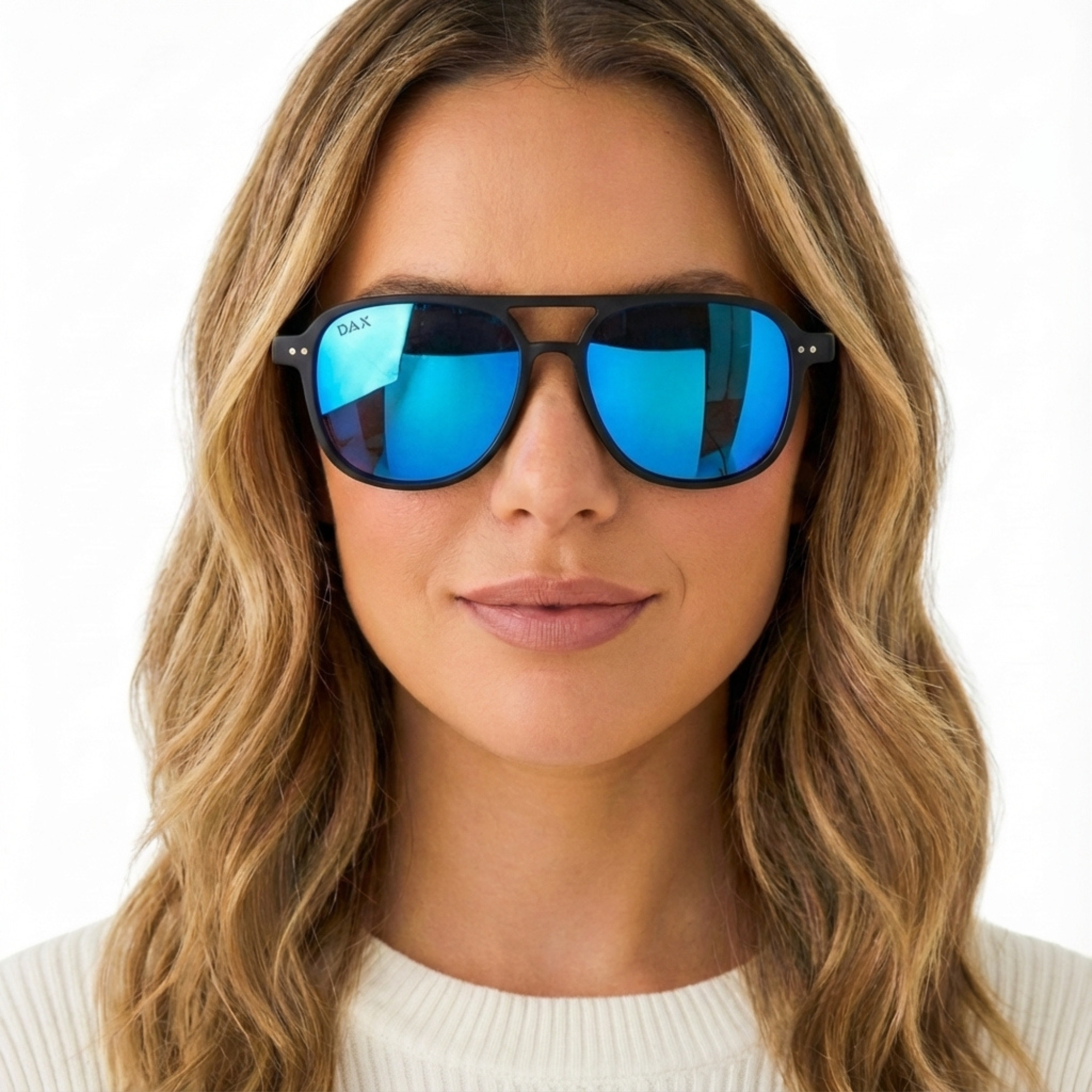 Woman wearing blue reflective sunglasses with a plain background