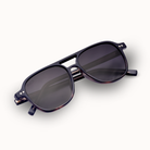 Black sunglasses with dark lenses on a white background
