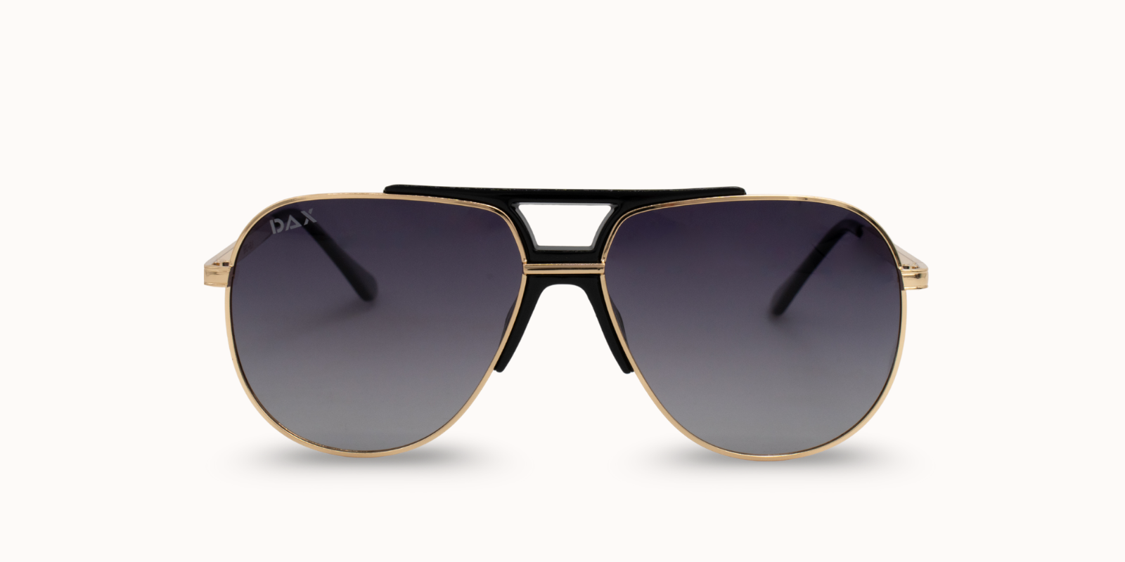 Gold-framed sunglasses with black gradient lenses on a white background