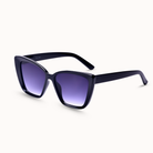 Black cat-eye sunglasses with purple gradient lenses on a white background