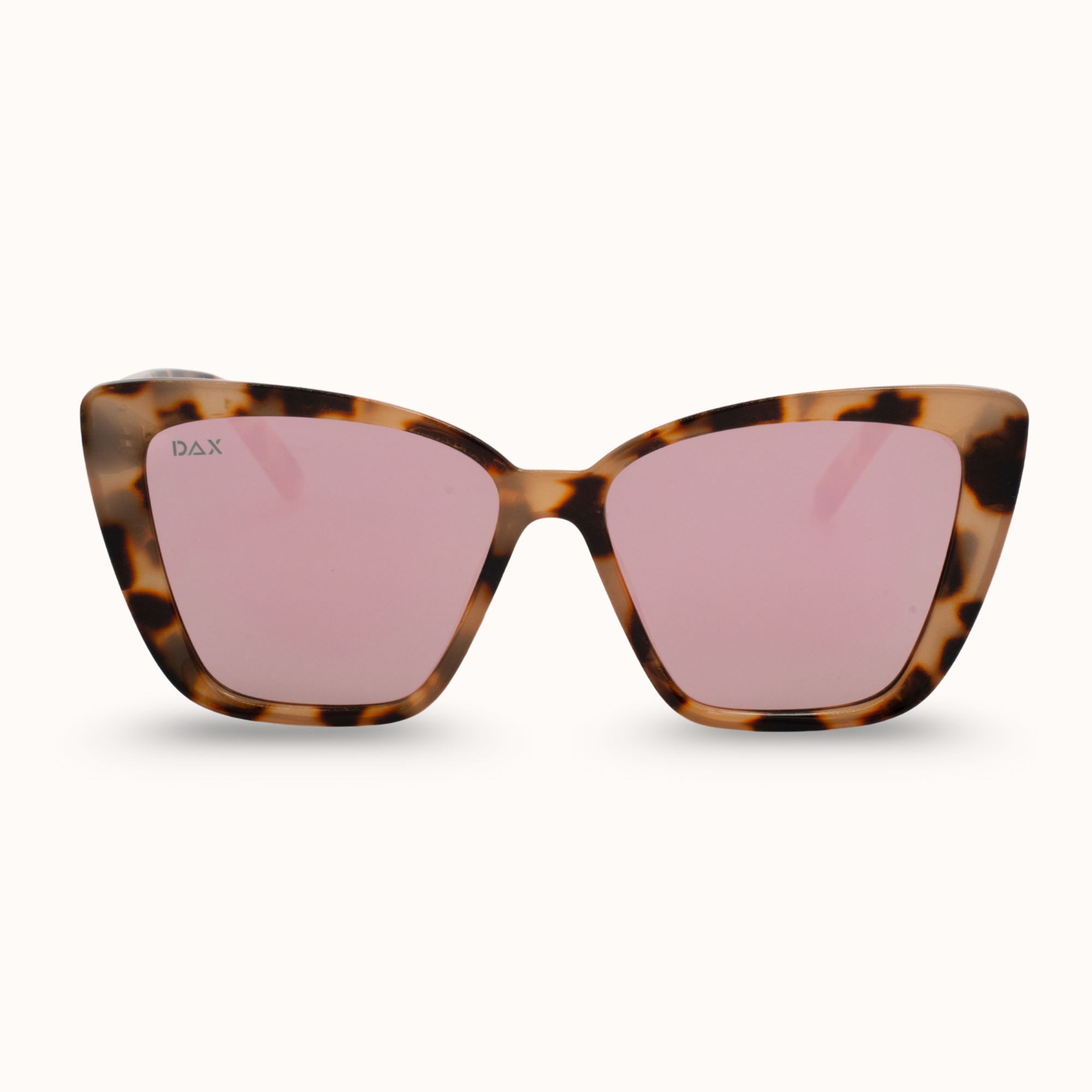 Sunglasses with tortoiseshell frame and pink lenses on a white background