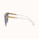 Sunglasses with gold frame and white arms on a white background