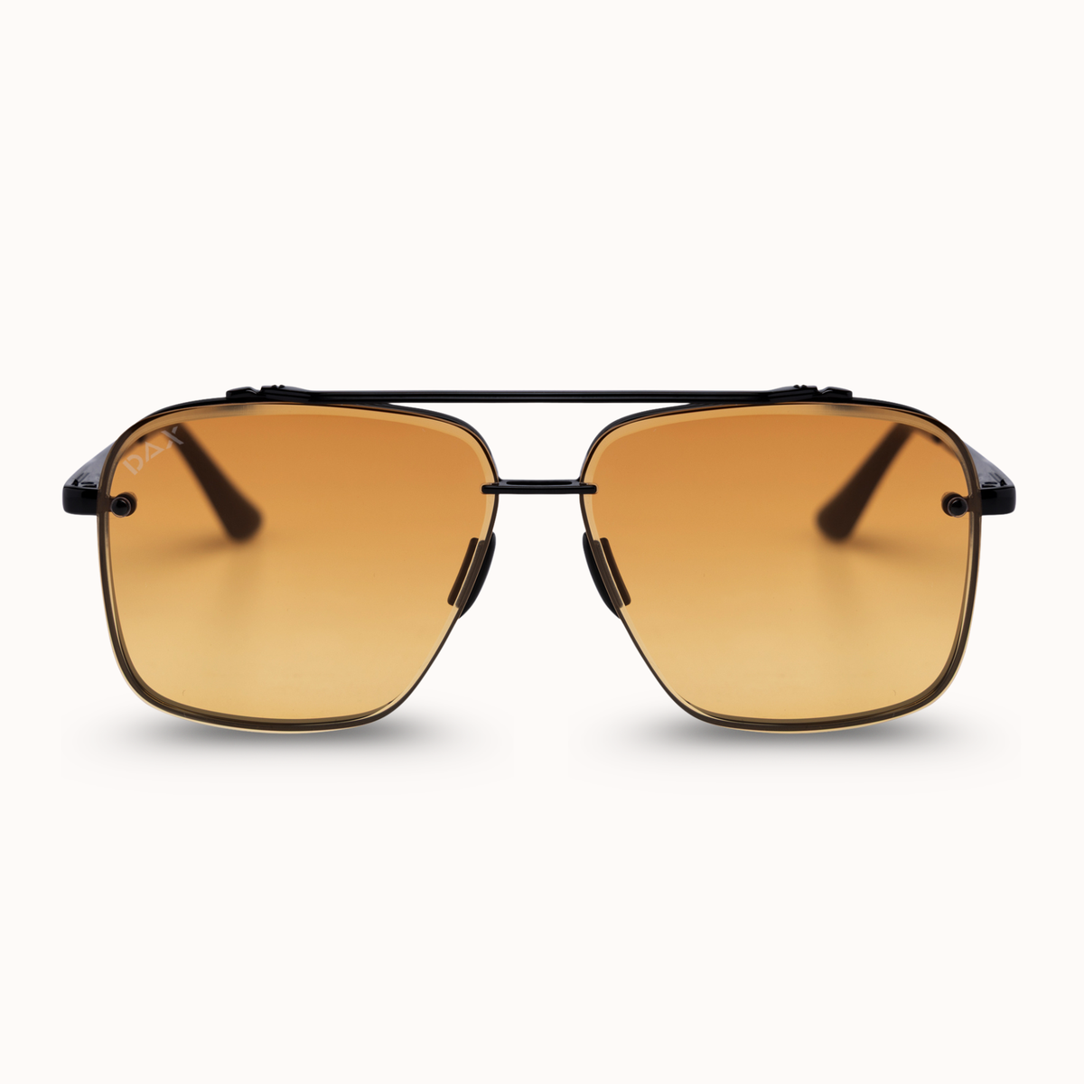 A pair of aviator-style sunglasses with a thin black metal frame and warm gradient amber lenses, shown against a clean off-white background.