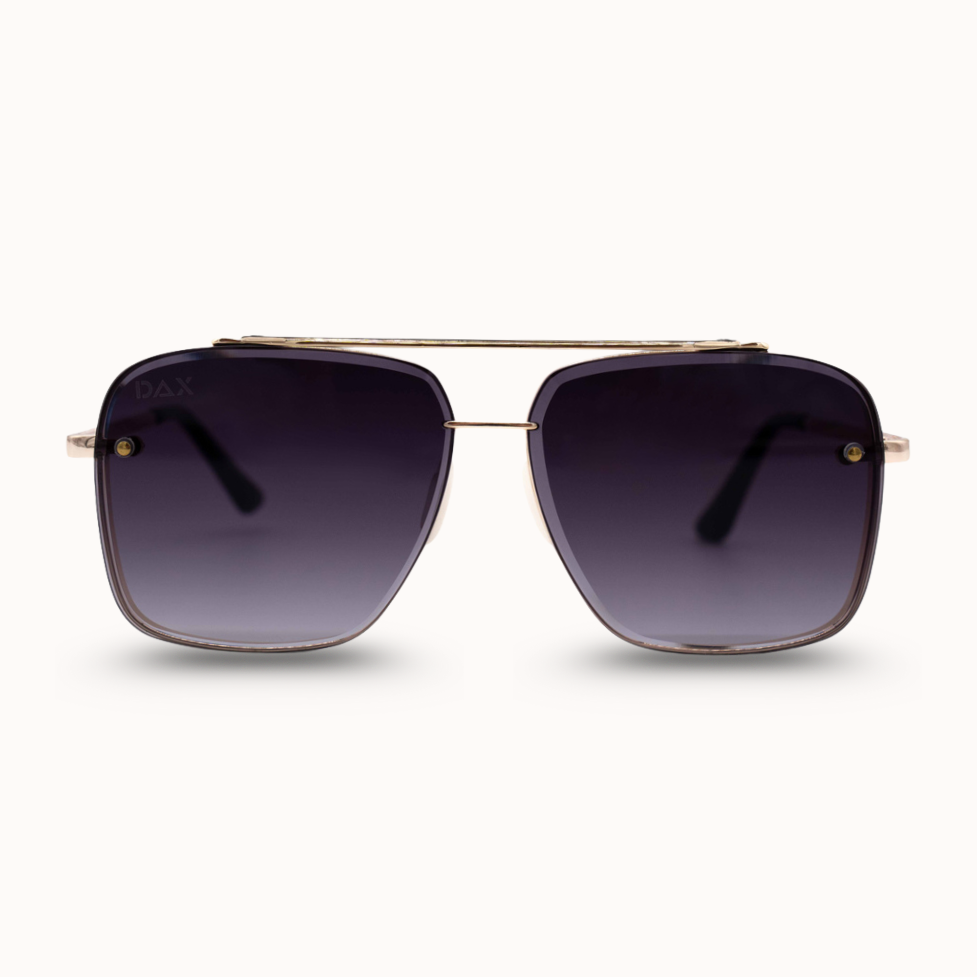 Sunglasses with dark lenses and gold frame on a white background