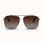 Gold-framed sunglasses with brown gradient lenses on a white background