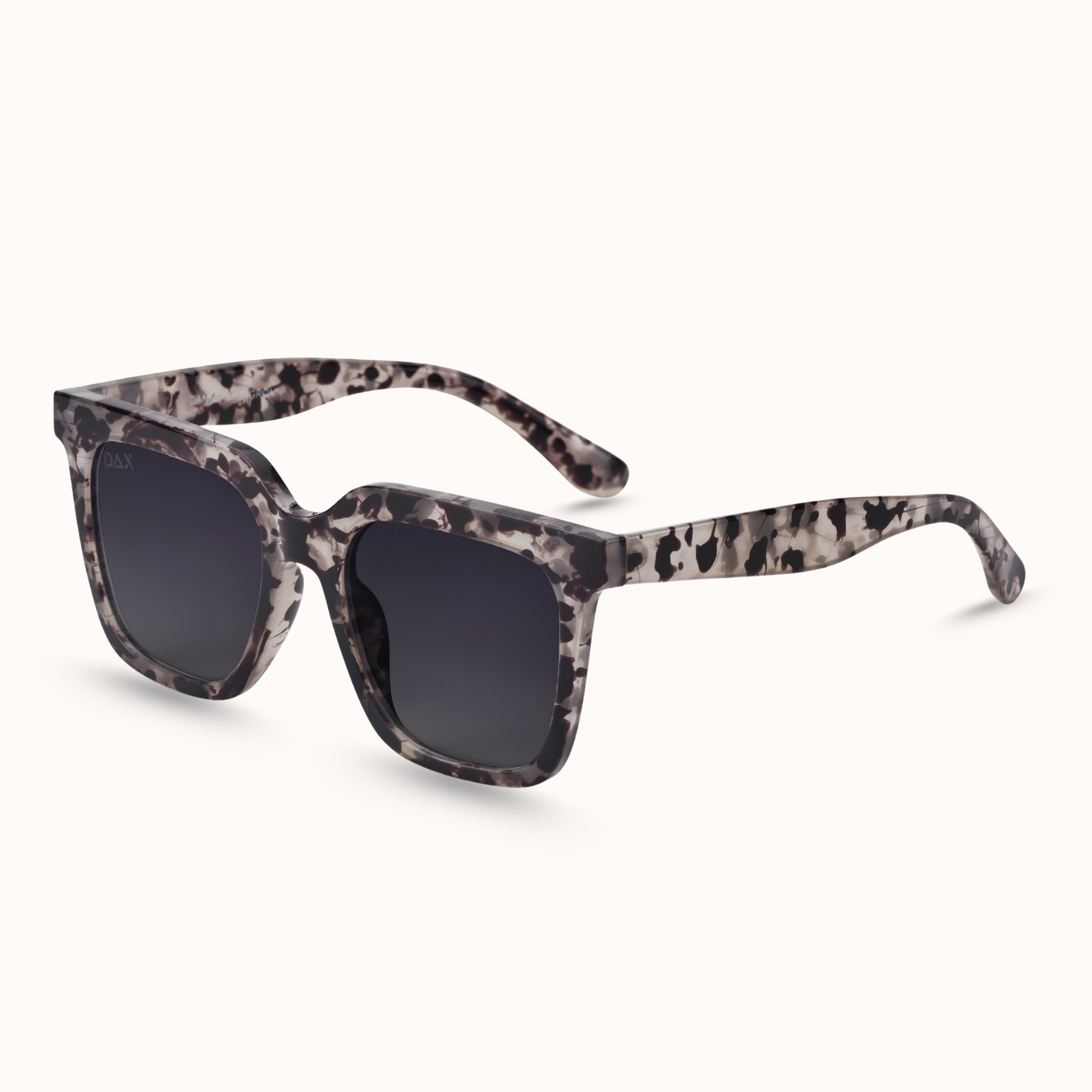Sunglasses with a grey patterned frame on a white background