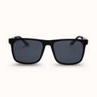 Black sunglasses with dark lenses on a white background