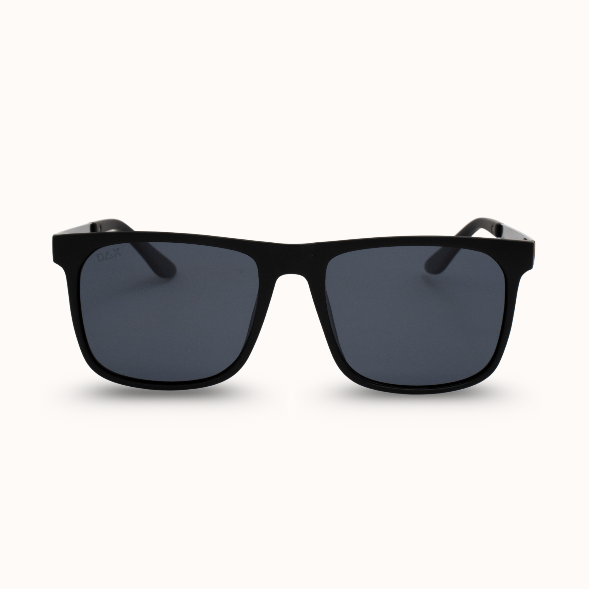 Black sunglasses with dark lenses on a white background