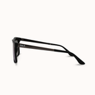Black sunglasses with 'DAX' branding on a white background