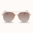 Sunglasses with gold frame and gradient lenses on a white background