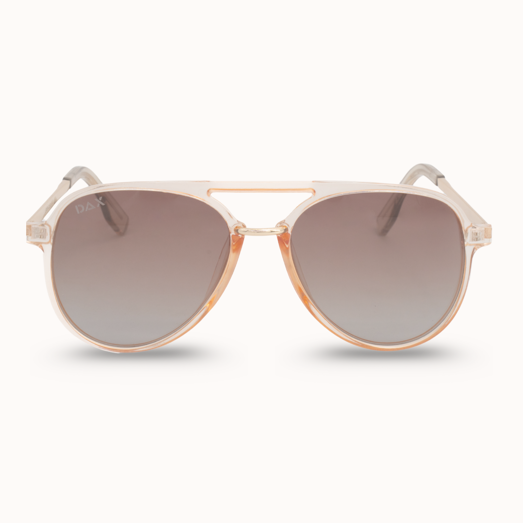 Sunglasses with gold frame and gradient lenses on a white background