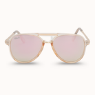 Sunglasses with gold frame and pink lenses on a white background