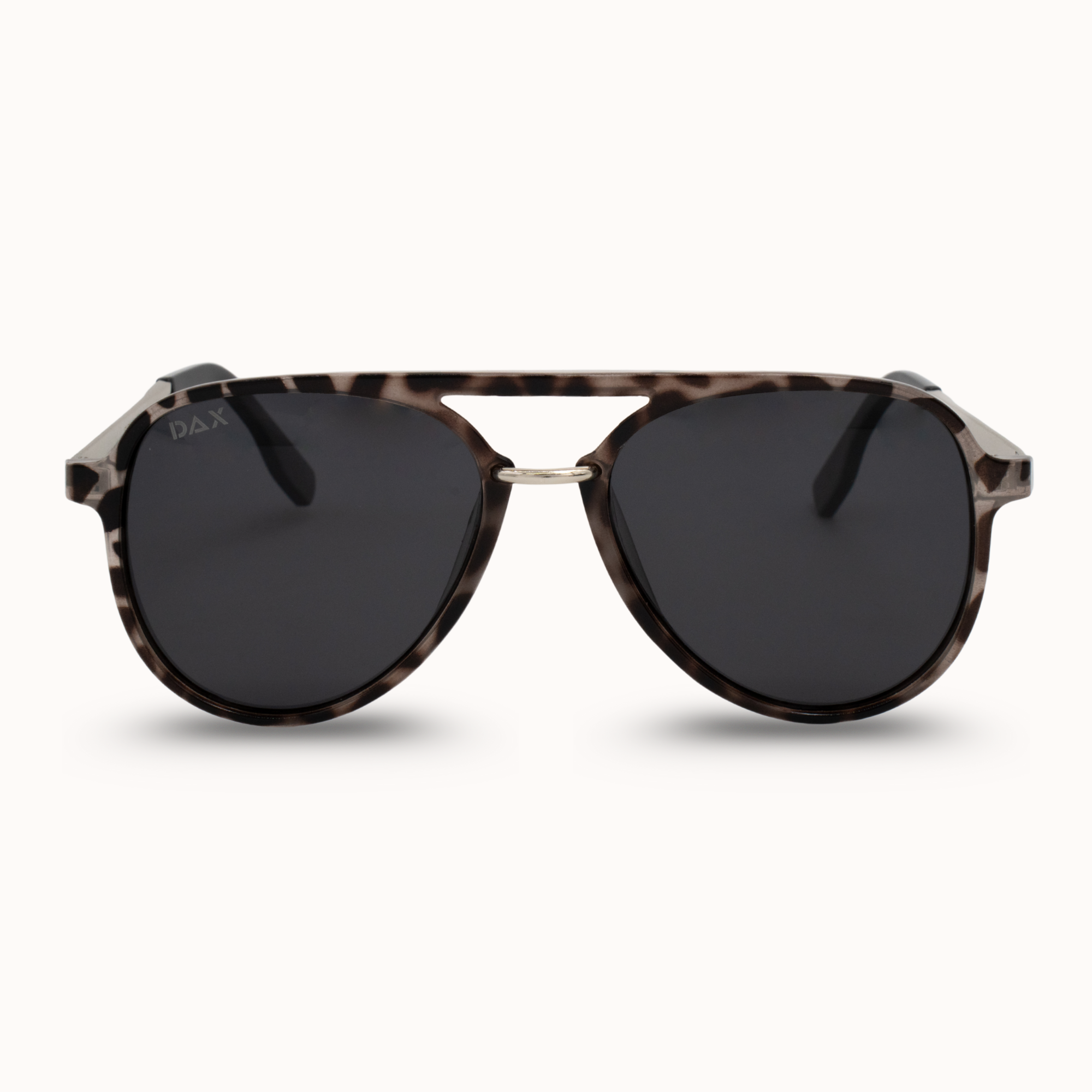 Sunglasses with tortoiseshell frame and dark lenses on a white background