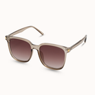 Sunglasses with brown gradient lenses and beige frame on a white background