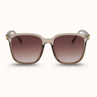 Sunglasses with a beige frame and brown gradient lenses on a white background