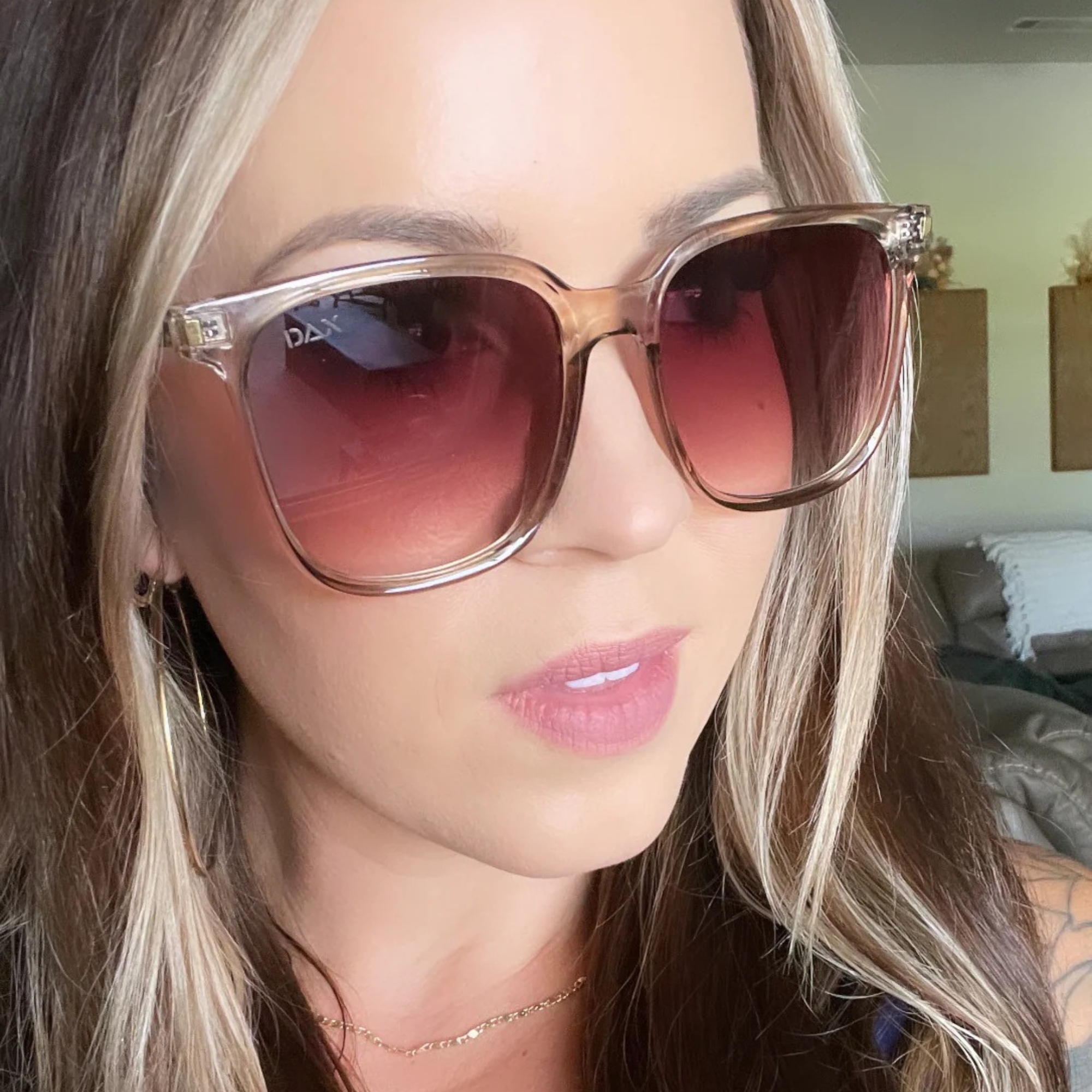 Woman wearing sunglasses with a blurred background