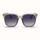 Sunglasses with a clear frame and dark gradient lenses on a white background