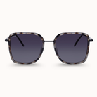 Sunglasses with tortoiseshell frame and dark lenses on a white background