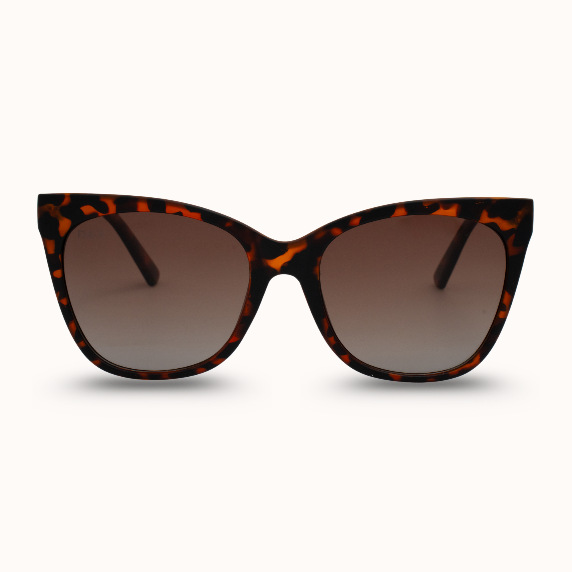 Cat-eye sunglasses with tortoiseshell frame on a white background