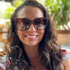 Woman wearing sunglasses with a blurred background