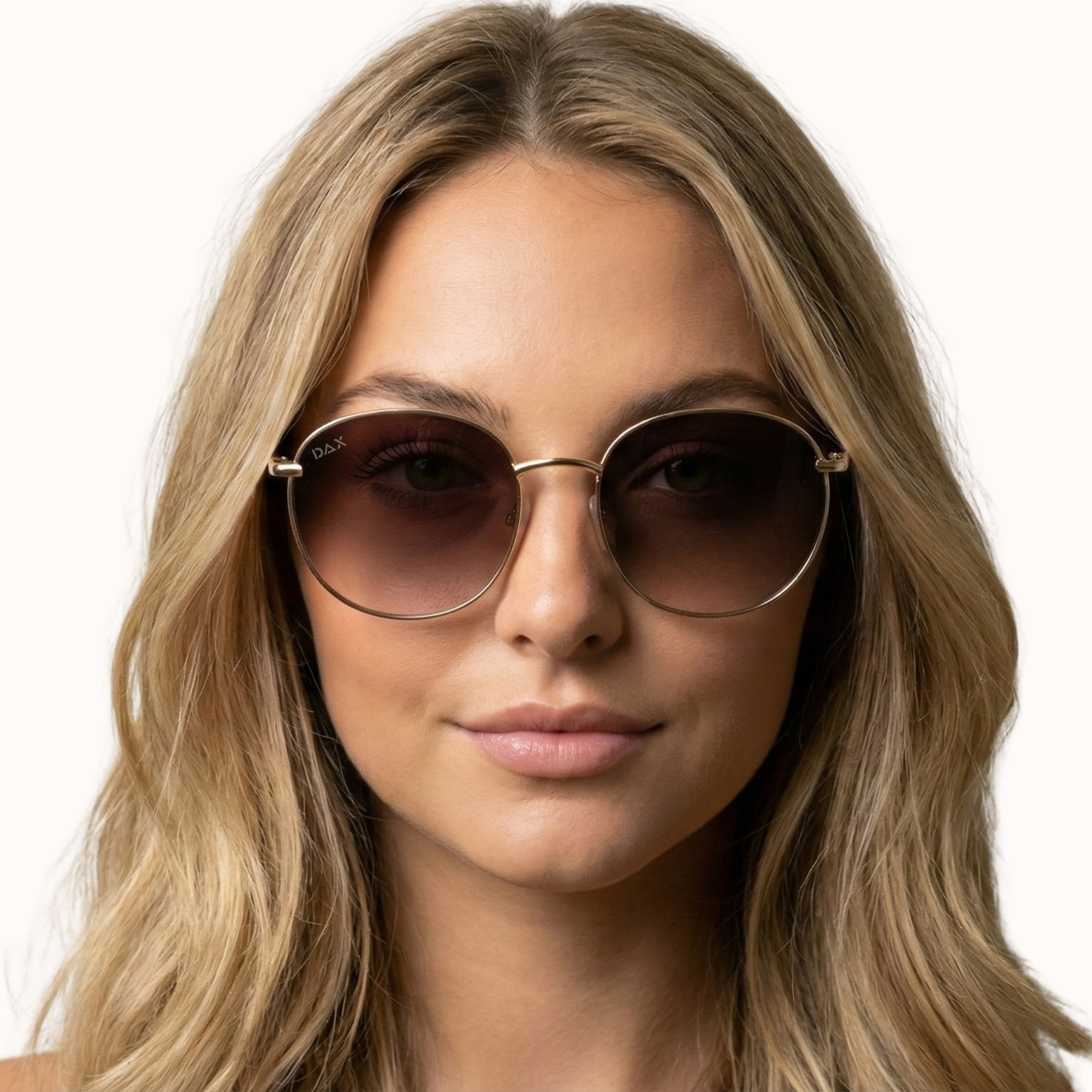 Woman wearing round sunglasses with a plain background