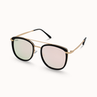 Sunglasses with gold frame and black lenses on a white background