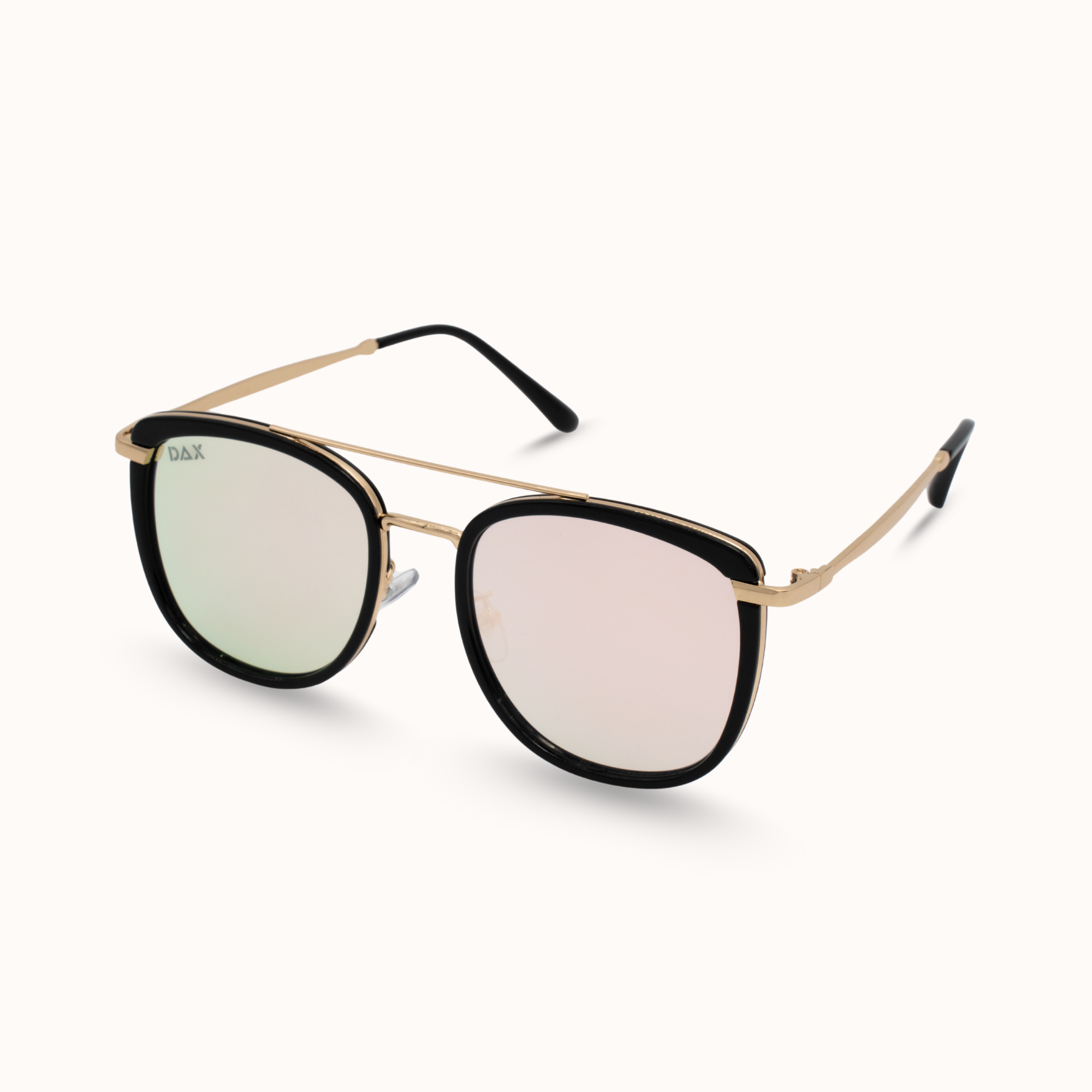 Sunglasses with gold frame and black lenses on a white background