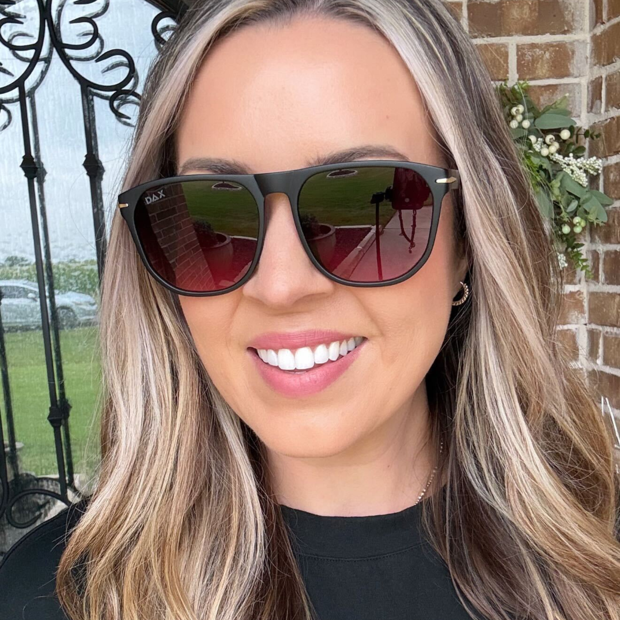 Woman wearing sunglasses with a blurred background