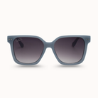 Blue sunglasses with gradient lenses on a white background