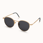 Gold-framed sunglasses with black lenses on a white background