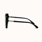 Sunglasses with black frame and green lenses on a white background