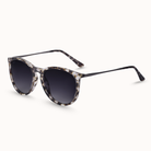 Sunglasses with tortoiseshell frame and dark lenses on a white background