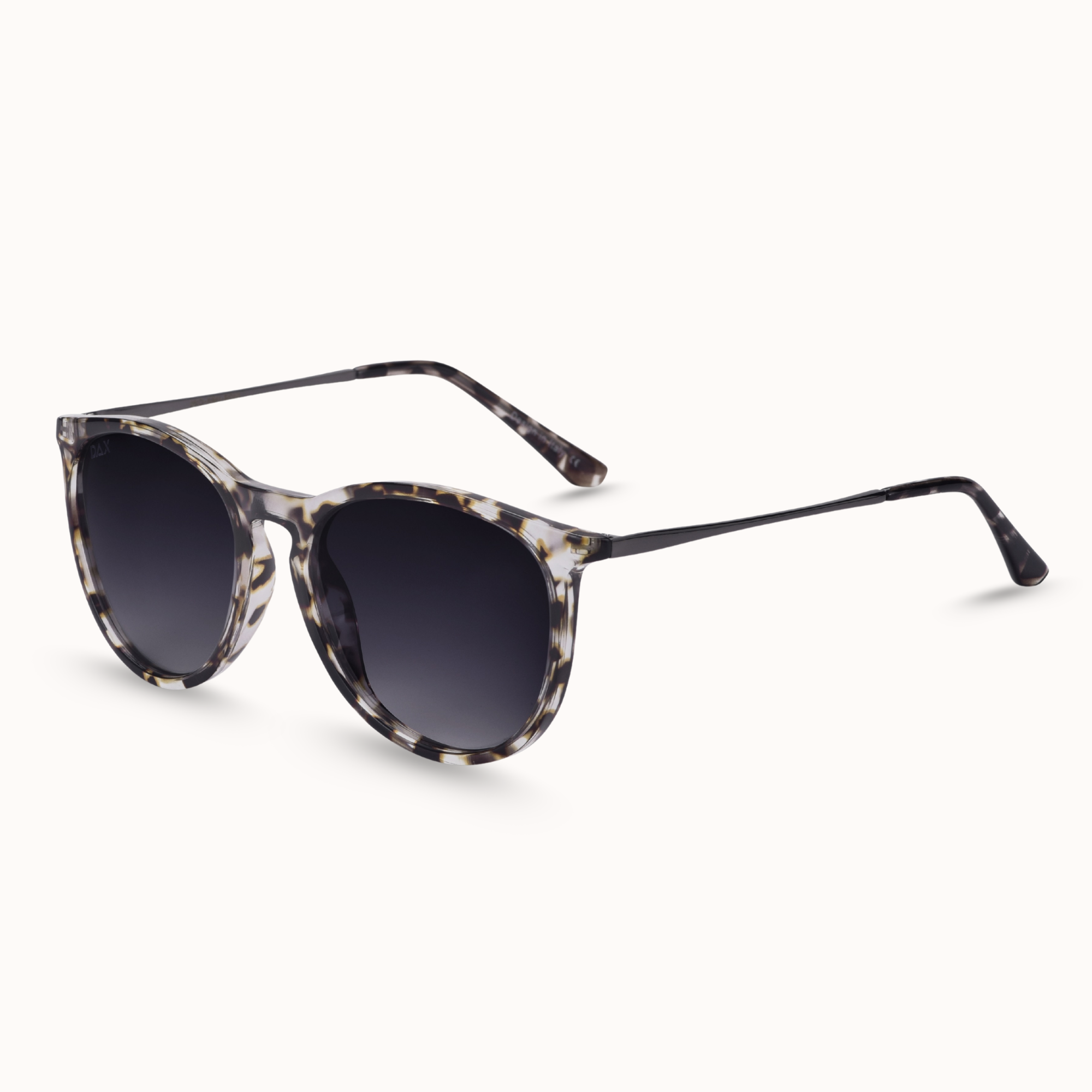 Sunglasses with tortoiseshell frame and dark lenses on a white background