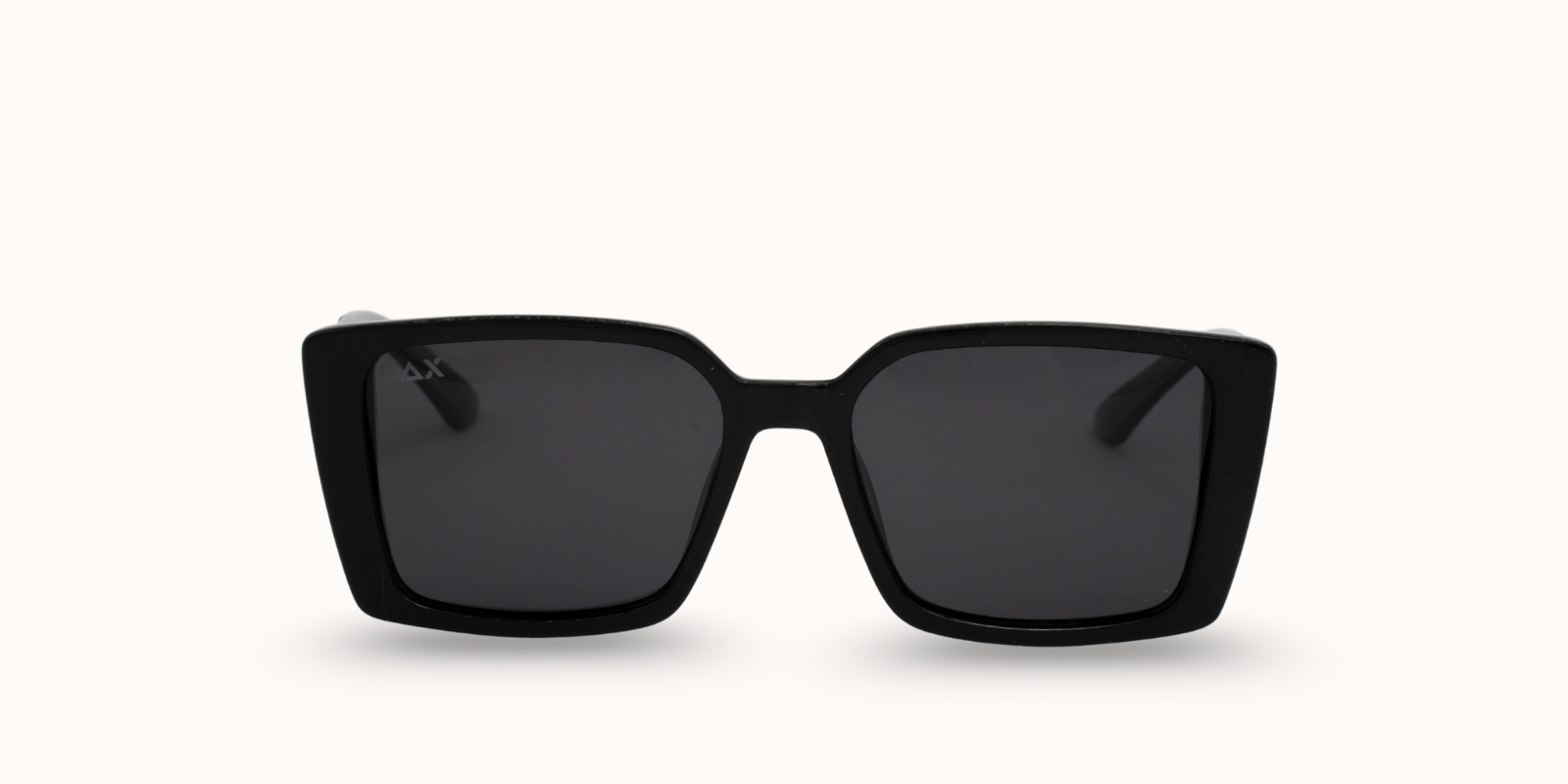 Black sunglasses with dark lenses on a white background