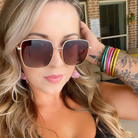 Woman wearing sunglasses with a blurred background